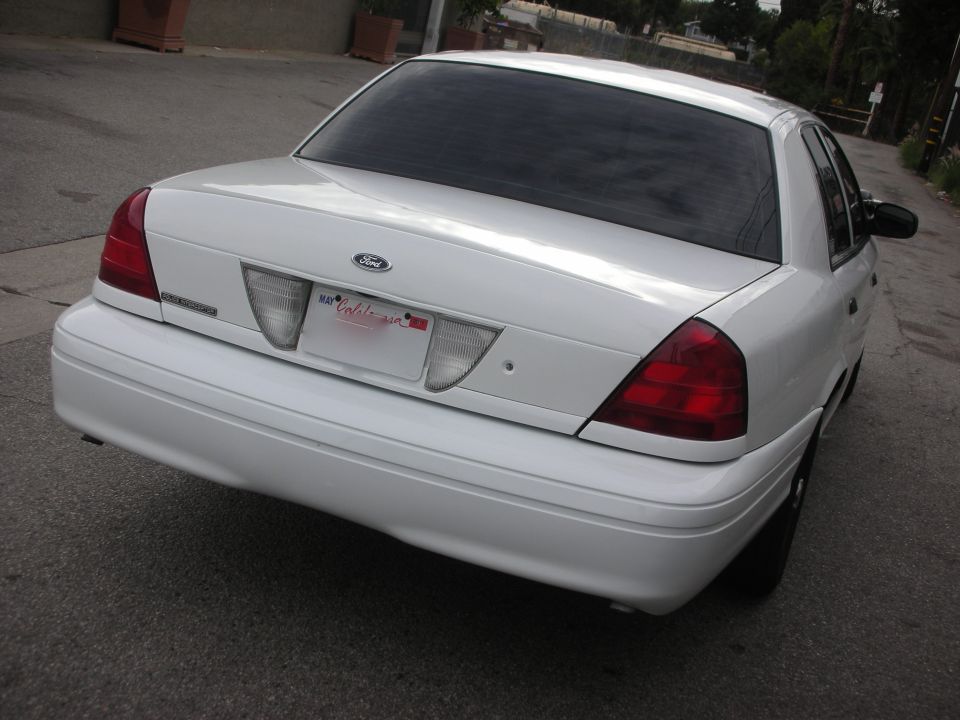 White 2004 Ford Crown Victoria rear view, California license plate visible
