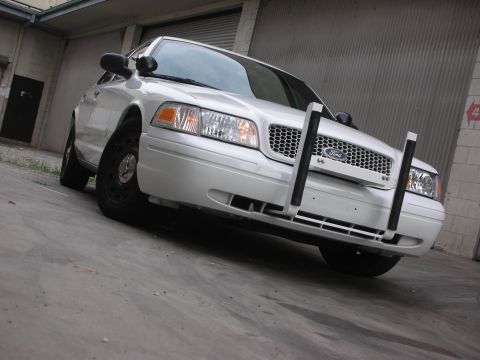 2004 Ford Crown Victoria - Front view of a white Ford Crown Victoria equipped with a push bumper.