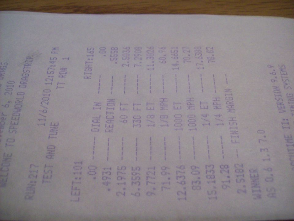 Drag strip time slip showing run data from November 6, 2010, including reaction time, 60 ft, 330 ft, 1/8 ET, 1/8 MPH, 1000 ET, 1000 MPH, 1/4 ET, 1/4 MPH, and finish margin