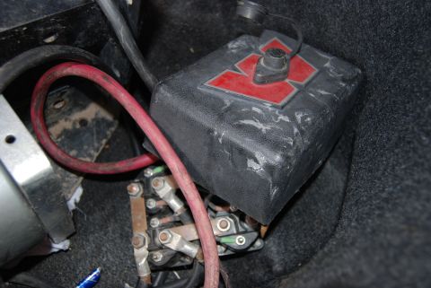 1982 Ford Bronco - Battery terminal connections and wiring are visible in this close-up view.