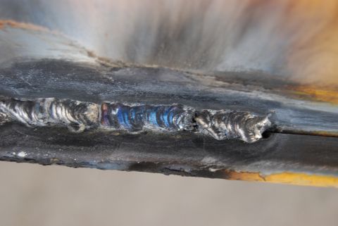 1982 Ford Bronco - A close-up view shows a rough welding seam with visible heat discoloration.
