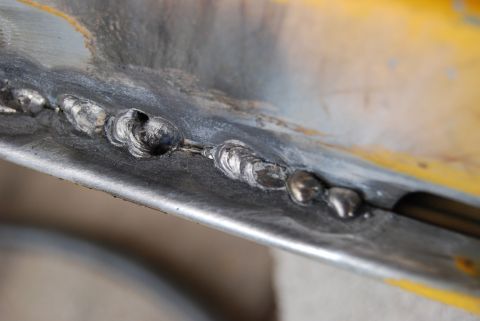 1982 Ford Bronco - Detail of welding on a metal panel, with a Supermotors.net watermark visible.