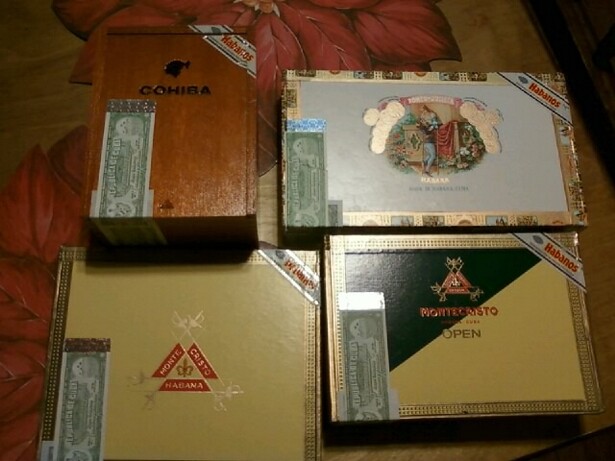 Four cigar boxes: Cohiba, Montecristo, and two others