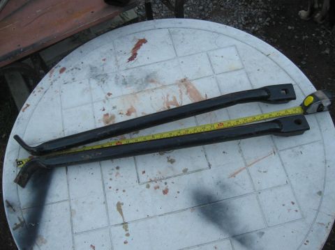 1981 Ford Bronco - Two metal bars are measured on a table, with a "SUPERMOTORS.NET" watermark visible.