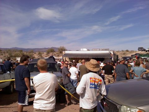1996 Ford Bronco - A 1996 Ford Bronco is seen outdoors with a crowd of people gathered around it.