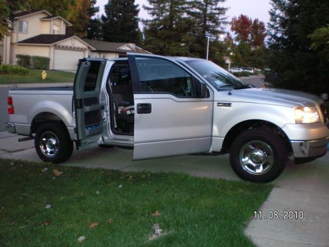 1996 Ford Bronco - This silver pickup truck appears to be from the mid-2000s, not a 1996 Ford Bronco.