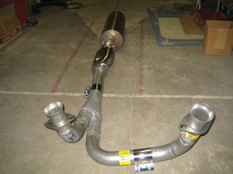 1996 Ford Bronco - An exhaust y-pipe assembly is shown, a flange and two distinct outlet pipes.
