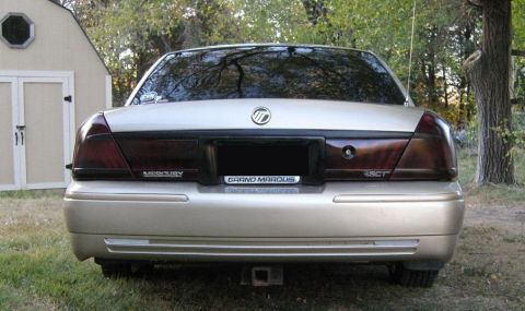 2000 Mercury Grand Marquis - Rear view of a 2000 Mercury Grand Marquis showing taillights and license plate area.