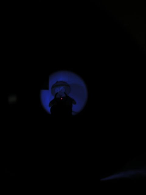 1996 Ford Bronco - A dimly lit scene shows a glowing object with blue light and a small red light, with a website logo at the bottom.