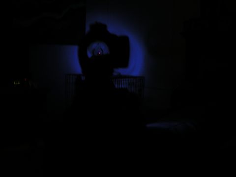1996 Ford Bronco - Headlight illuminated with blue light, Supermotors.net logo visible.