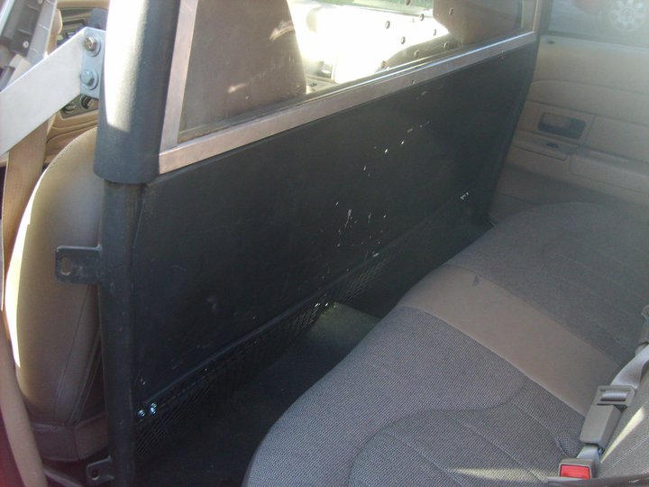 Interior shot of a partition separating front and rear seats in a vehicle