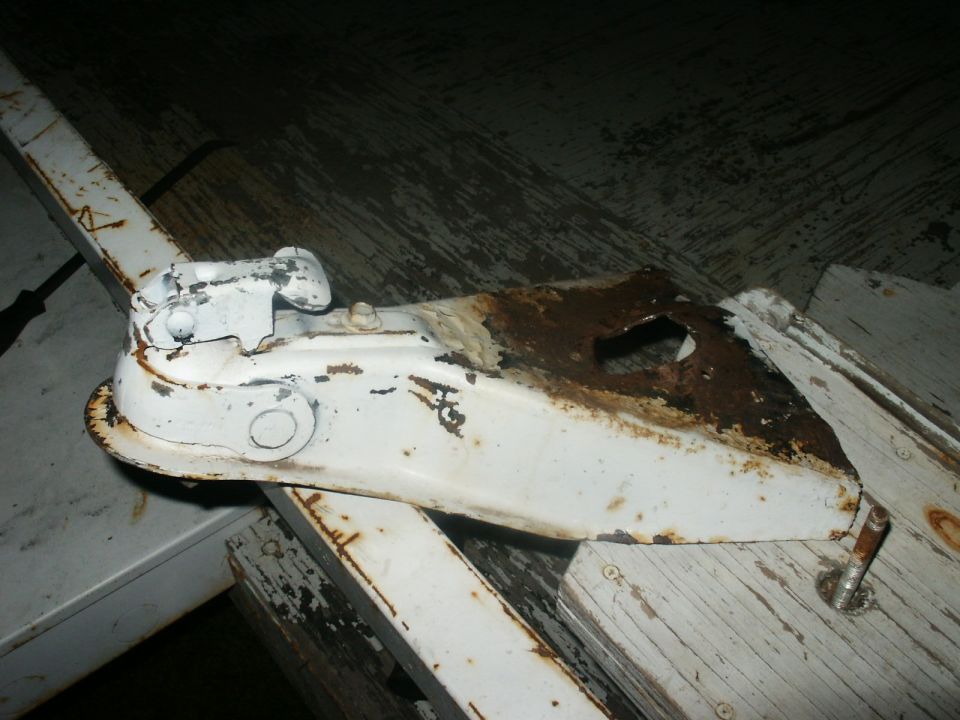 White trailer hitch with rust and chipped paint