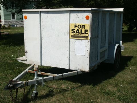 1990 Ford Bronco - Utility trailer with a 'For Sale' sign and additional paperwork attached to the side.