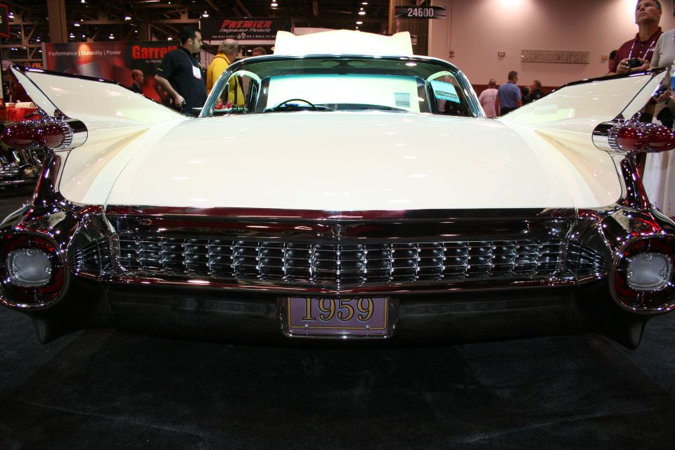 Front of white 1959 Cadillac with chrome grille and 1959 license plate