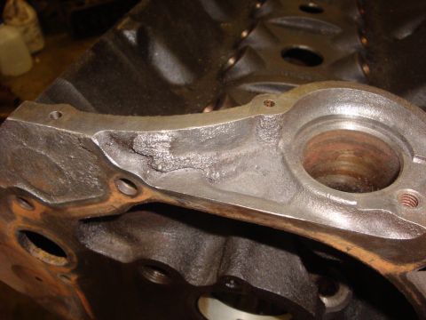 1989 Ford Bronco - This image shows a close-up view of a damaged engine block casting, likely requiring repair or replacement.
