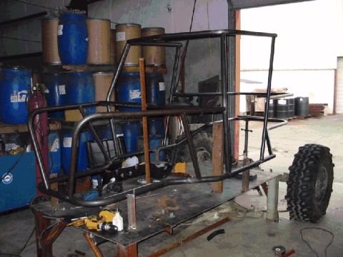 1994 Ford Bronco - This appears to be a custom roll cage frame being built in a workshop, not a 1994 Ford Bronco.