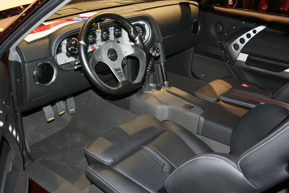 Custom car interior with racing wheel and three-pedal setup
