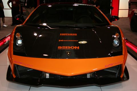 1998 Ford Crown Victoria - Head-on view of an orange and black Lamborghini Gallardo with Seibon, Mothers and AutoTalent decals.