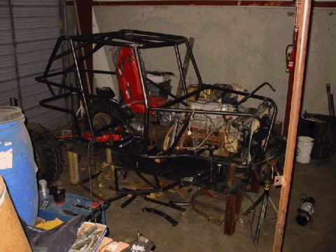 1994 Ford Bronco - This custom off-road buggy frame, complete with engine and a red racing seat, is shown during its construction phase.