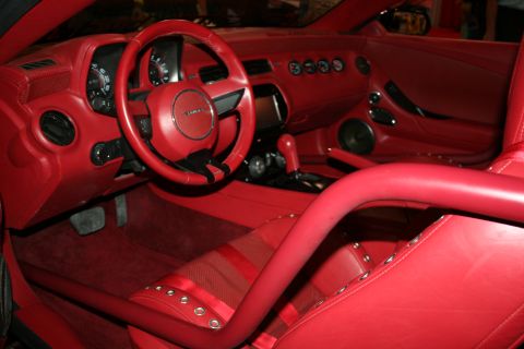 1998 Ford Crown Victoria - custom Camaro interior trimmed entirely in red, with a roll bar, red steering wheel and red dashboard.