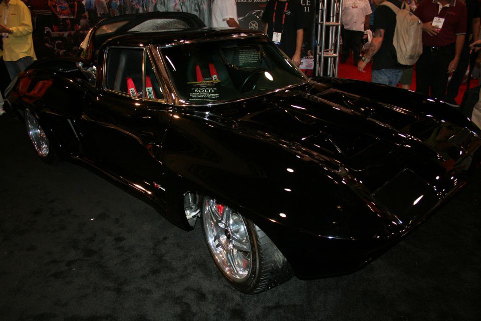 Front three-quarter of a black custom Corvette Sting Ray coupe at a show
