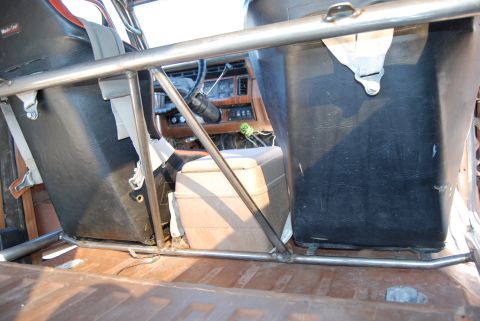 1982 Ford Bronco - Roll cage and bucket seats visible inside the interior of a 1982 Ford Bronco.