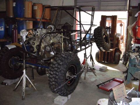 1994 Ford Bronco - Custom off-road vehicle frame undergoing construction in a workshop setting.