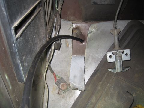 1979 Ford Bronco - Close-up of under-dash components including wiring and a latch mechanism.