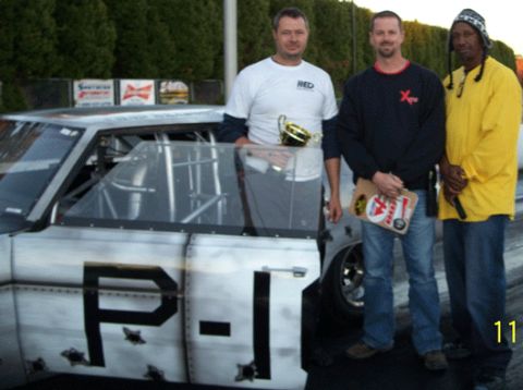 1992 Ford Mustang - Three men pose with a custom drag car that has 'P-I' painted on its side.