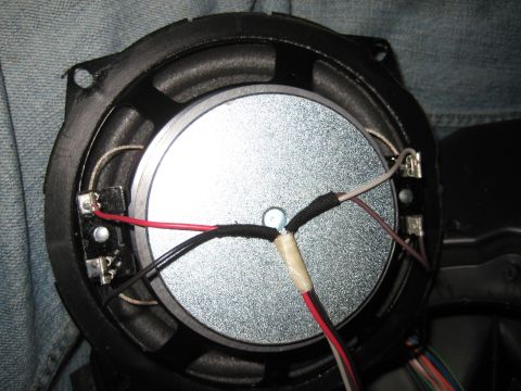 2005 Jeep Wrangler - A speaker is shown with its wiring connected to the terminals.