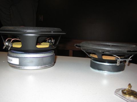 2005 Jeep Wrangler - Two car speakers are shown on a table, with one a visible label.