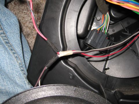 2005 Jeep Wrangler - Close-up of a vehicle's wiring harness, showing a spliced connection and a multi-pin connector.