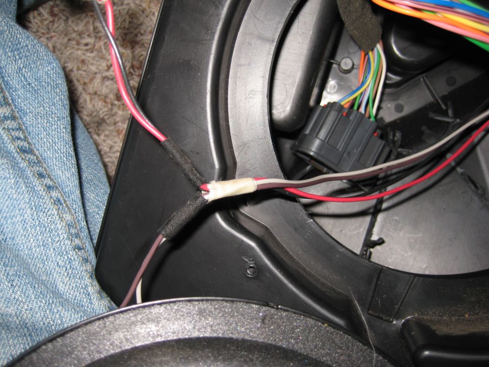 Wiring harness with spliced wires and a black connector