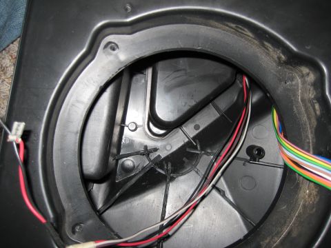 2005 Jeep Wrangler - Close-up of a speaker enclosure showing wiring and mounting points.