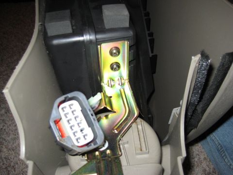 2005 Jeep Wrangler - Close-up of an interior car component, possibly related to a sub-woofer installation.