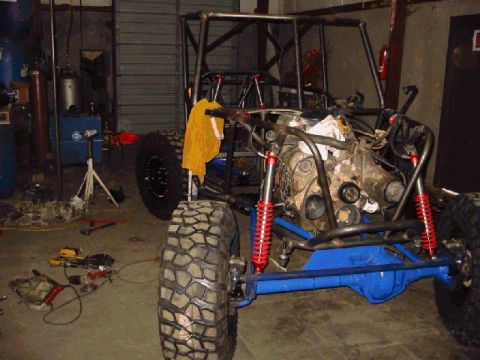 1994 Ford Bronco - Custom off-road buggy under construction, showing its frame, engine, and suspension components.