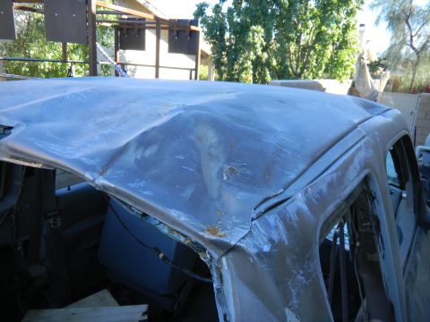 1997 Ford Ranger - This truck's roof has seen better days, with major damage visible.