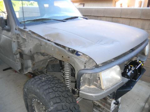 1997 Ford Ranger - This truck appears to be undergoing repairs or modifications, with significant damage to the front driver's side and a winch installed.