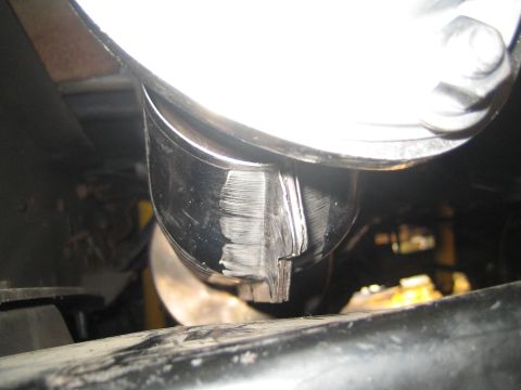 1996 Ford Bronco - This photo shows a close-up view of a chrome exhaust pipe tip, likely from the underside of a vehicle.