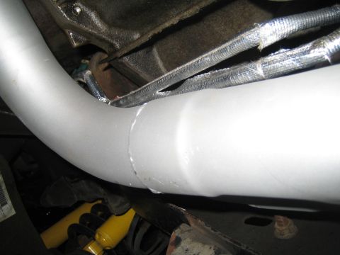 1996 Ford Bronco - Close-up view of vehicle undercarriage components including exhaust and suspension.