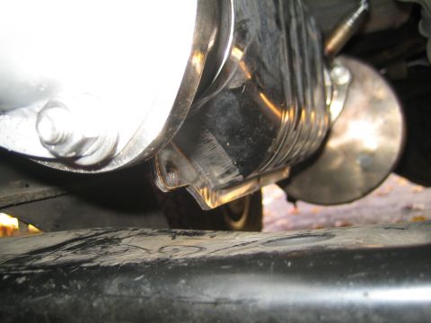 1996 Ford Bronco - Underside view of a vehicle's exhaust system, focusing on the muffler and pipe.