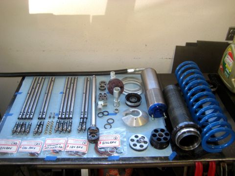 1996 Ford Bronco - Collection of suspension parts, possibly for a performance vehicle build.