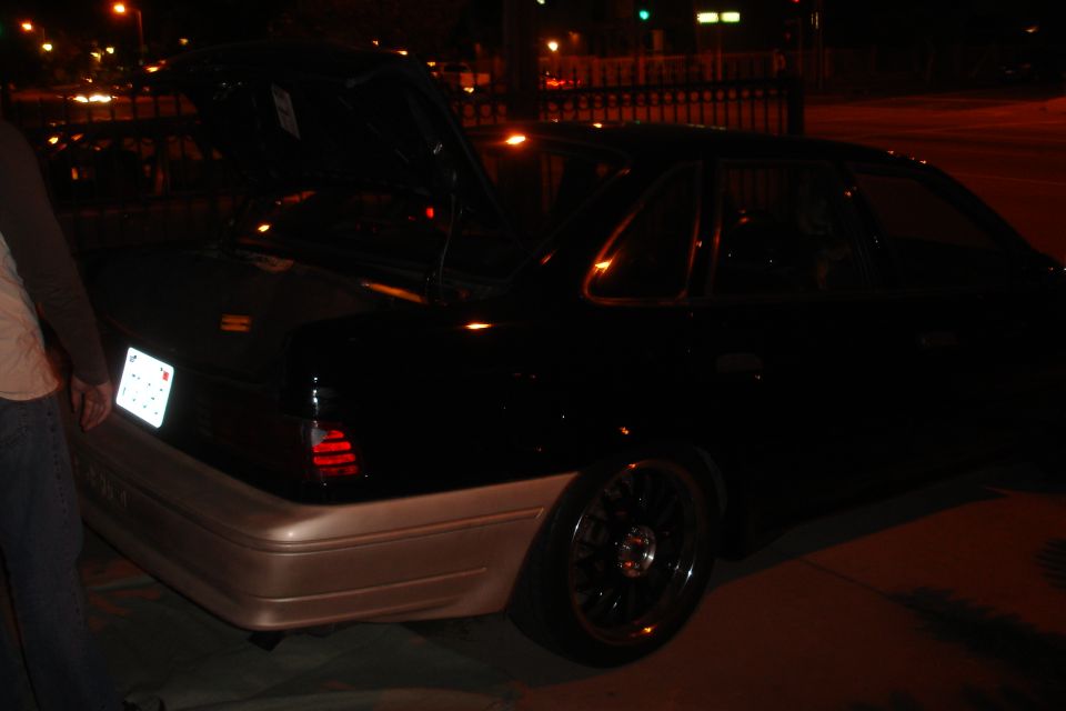 1993 Ford Taurus rear view, trunk open, two-tone paint