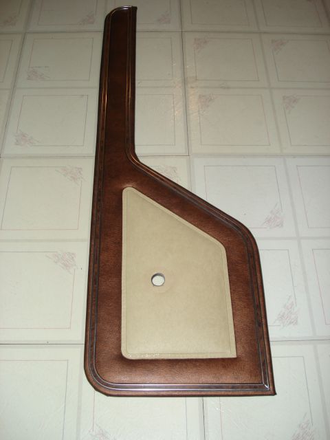 1979 Ford Bronco - This is a brown and tan door panel, likely from an older vehicle. The registry claims it is a 1979 Ford Bronco, but this is unconfirmed.