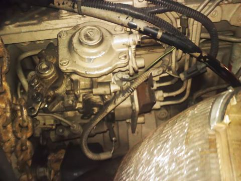 1990 Ford Bronco - Detail of an engine's fuel injection pump assembly, showing various components and connections.