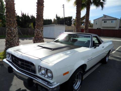 1973 Ford Ranchero - This 1973 Ford Ranchero features a distinctive black hood stripe and a classic pickup truck bed.