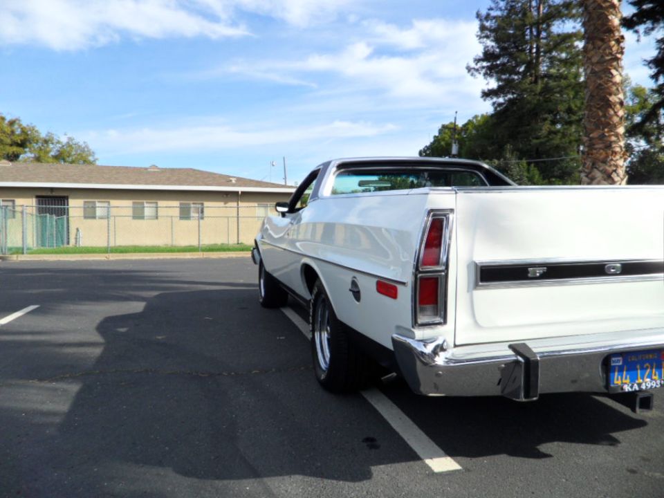1973 Ford Ranchero rear view, white with black trim, parked in lot