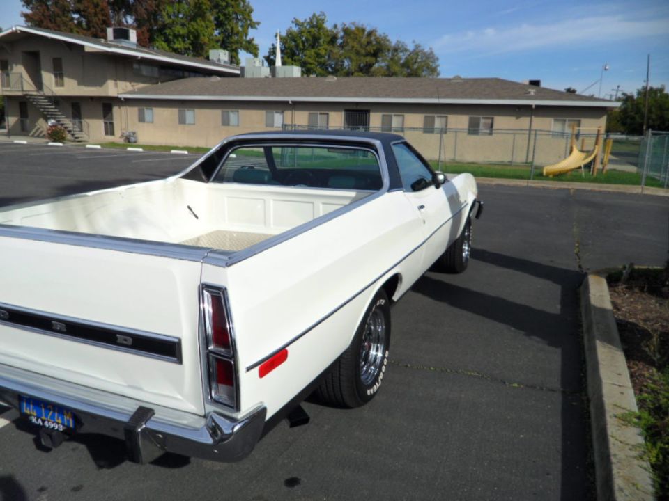 White 1973 Ford Ranchero parked in a lot, showing its rear and side profile