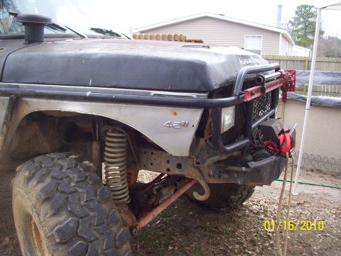 1978 Ford Bronco - This modified off-road vehicle has a snorkel and a winch mounted on the front bumper.