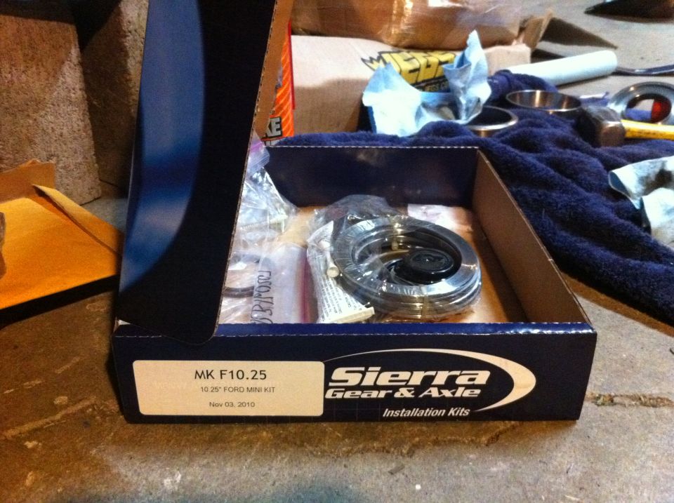 Sierra Gear & Axle installation kit box with parts inside, on a concrete floor